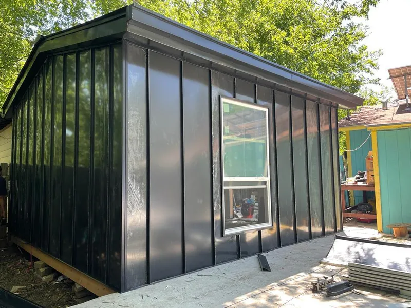 Black standing seam metal wall panels for Roof Inspection in Barrington